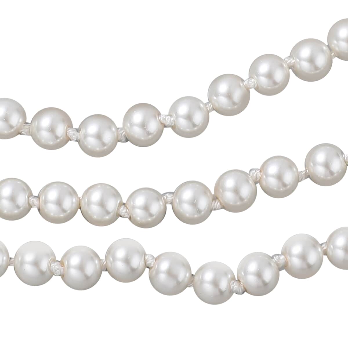 Simulated White Pearl and White Austrian Crystal Triple Row Necklace 20-23 Inches with Bow Clasp in Silvertone image number 3