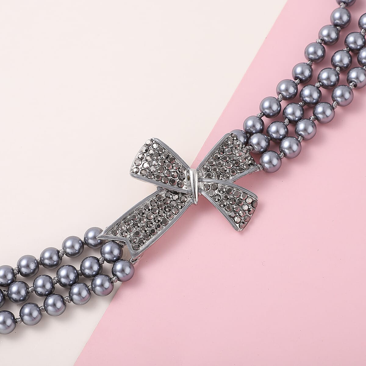 Simulated Gray Pearl and Gray Austrian Crystal Triple Row Necklace 20-23 Inches with Bow Clasp in Silvertone image number 1