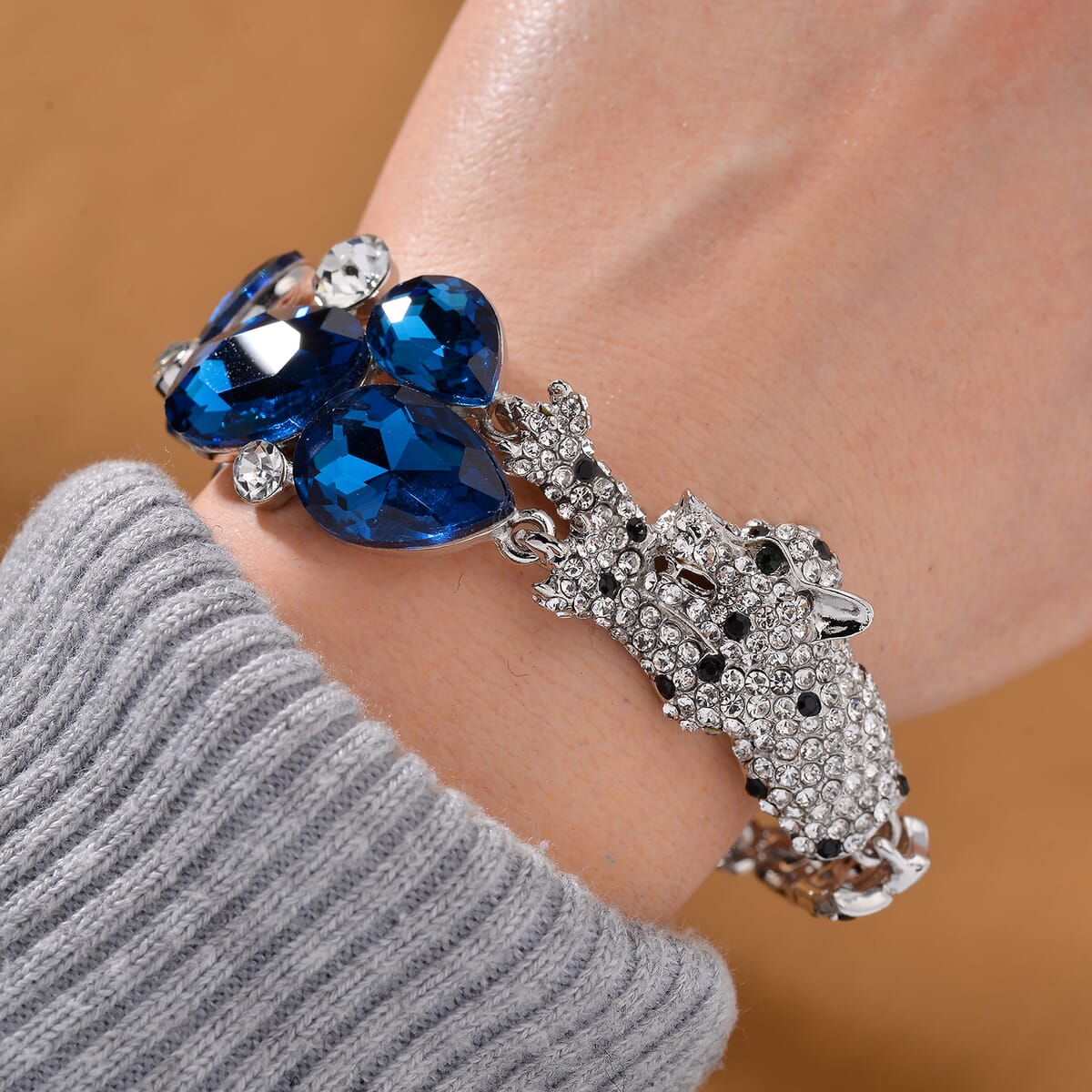 Simulated Blue Sapphire and Austrian Crystal Panther Bracelet in Silvertone (7.50 In) image number 1