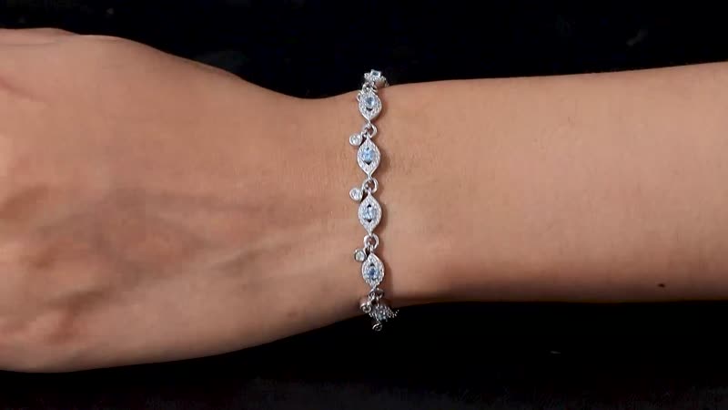 Blue Topaz and White Zircon Bracelet in Platinum Over Sterling Silver (7.25 In) 3.70 ctw