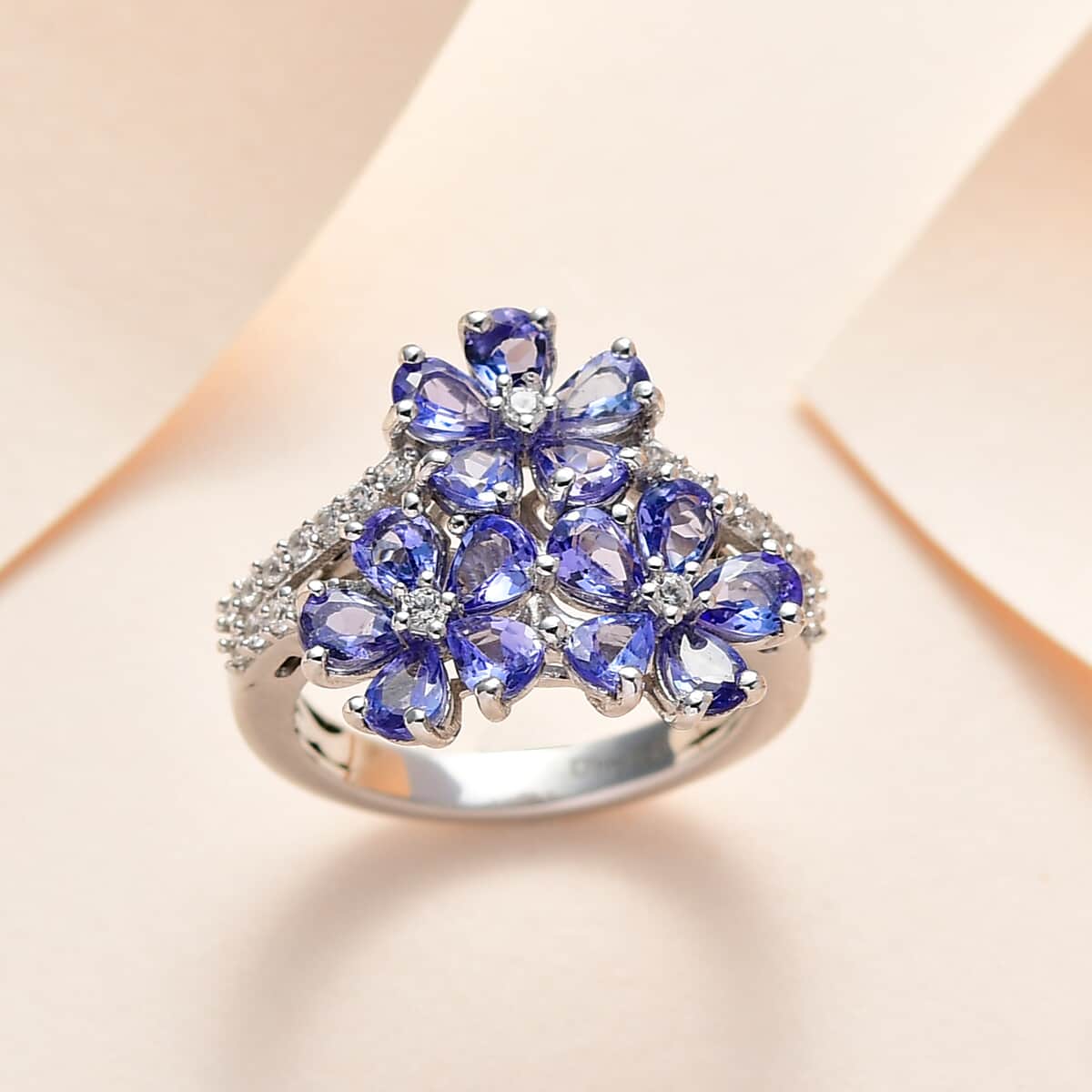 Tanzanite and White Zircon Floral Ring in Platinum Over Sterling Silver (Size 9.0) 2.35 ctw image number 1