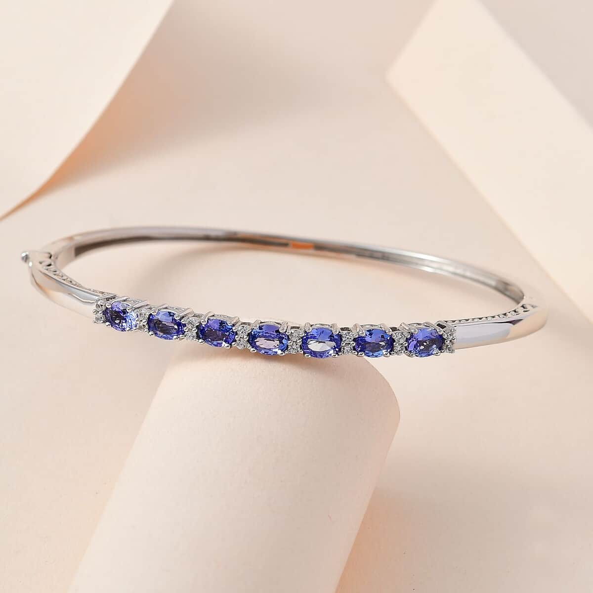 Tanzanite and White Zircon Bangle Bracelet in Platinum Over Sterling Silver (7.25 in) 2.50 ctw image number 1