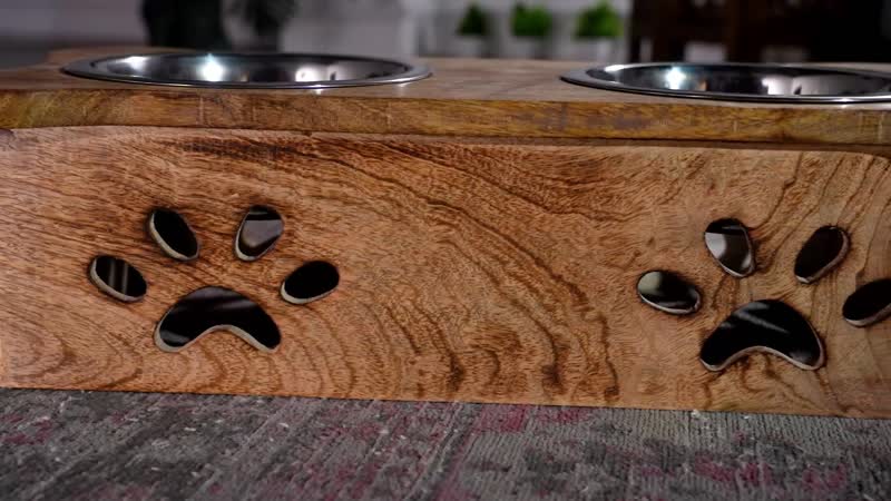 NAKKASHI, Hand Carved, Mango Wood Pet Feeder with Stainless Steel Bowls. Finish: White. Size: Approx. 18L X 7.5W X 5H inch. Bowl: Approx. Diameter 6.5 inch, depth: 2.5 inch.
