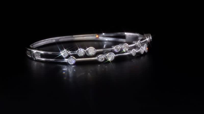 Moissanite Bangle Bracelet in Platinum Over Sterling Silver (7.50 In) 2.10 ctw
