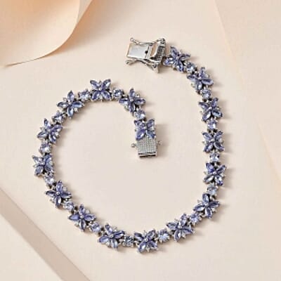 Tanzanite and White Zircon 10.20 ctw Cluster Bracelet in Rhodium Over Sterling Silver (7 In) (14.23 g)