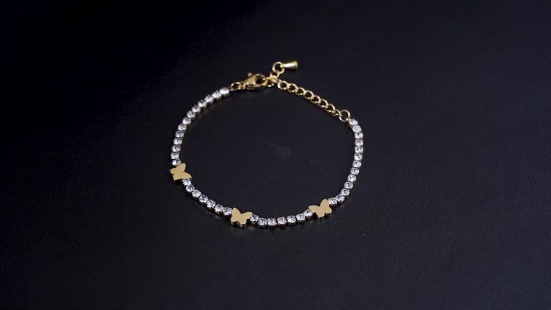 Simulated Diamond Butterfly Bracelet in ION Plated YG Stainless Steel (6.00-7.50In)