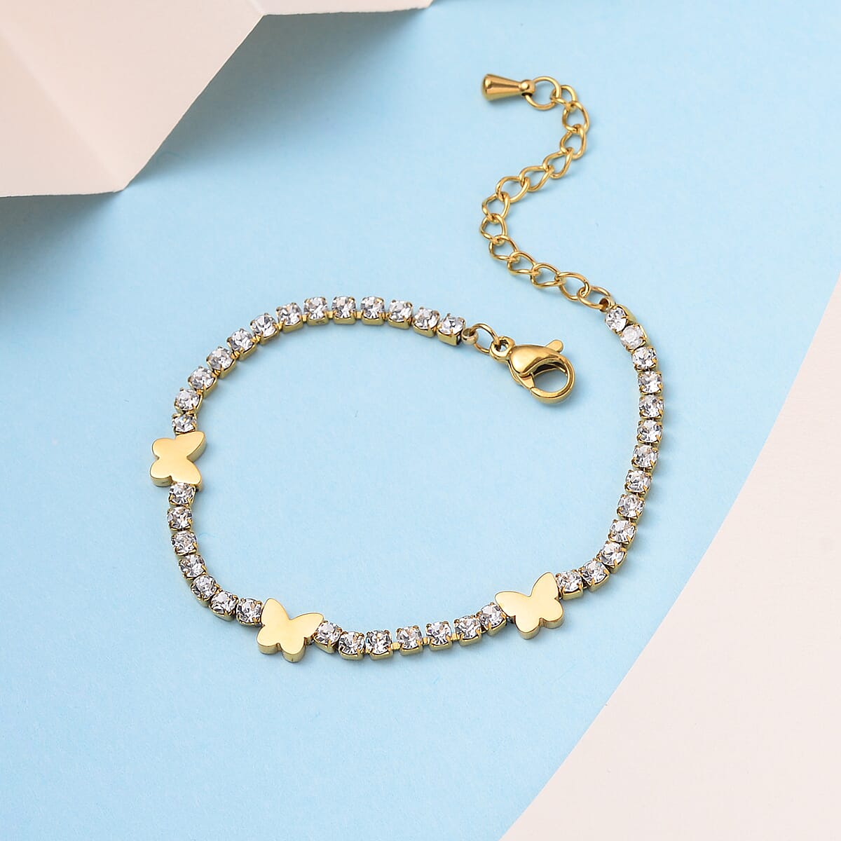 Simulated Diamond Butterfly Bracelet in ION Plated YG Stainless Steel (6.00-7.50In) image number 1