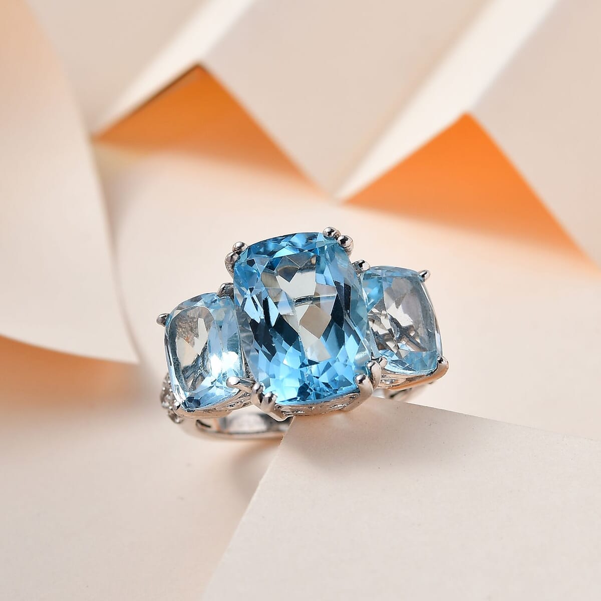 Blue Topaz and White Zircon 12.75 ctw Trilogy Ring in Platinum Over Sterling Silver (Size 5.0) image number 1