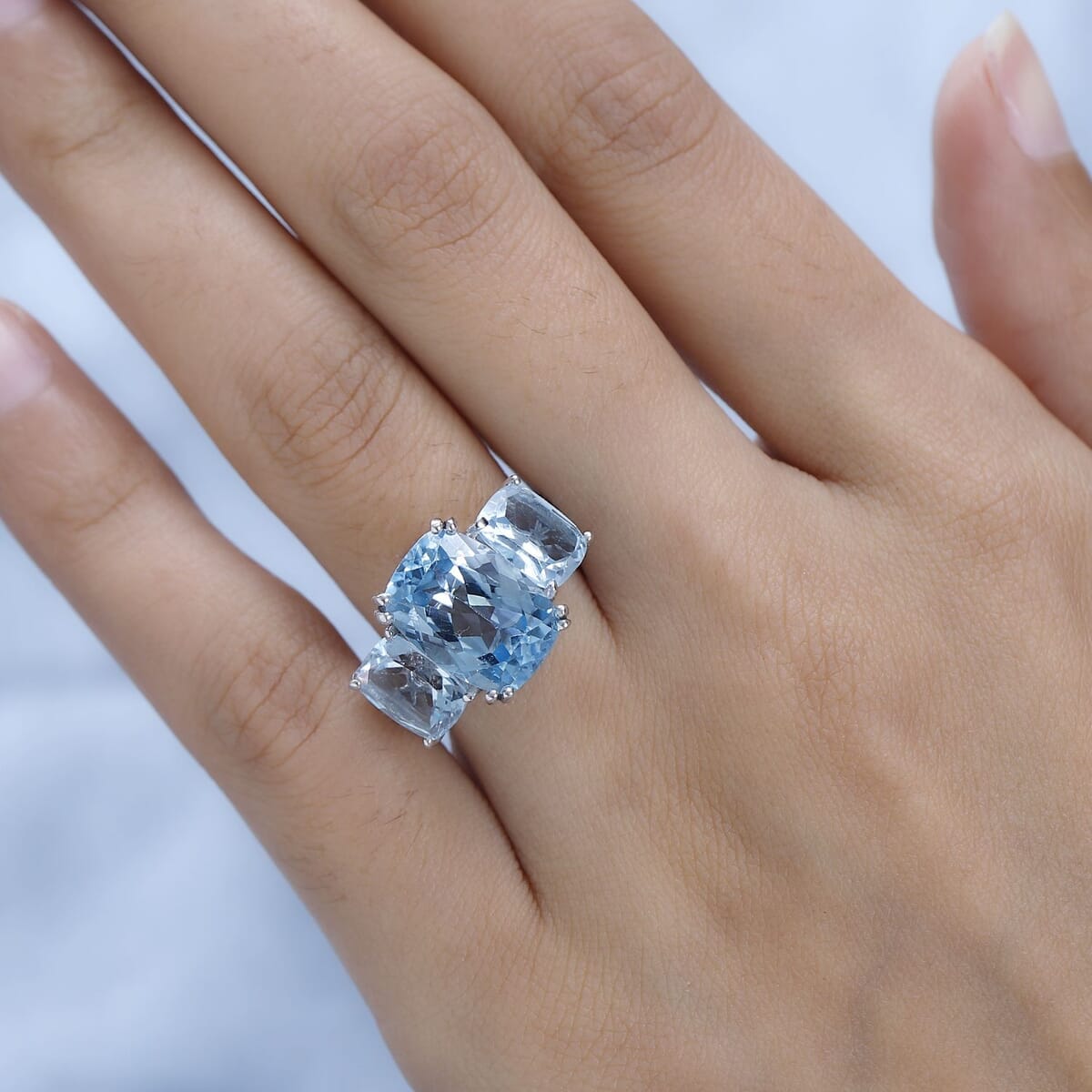 Blue Topaz and White Zircon 12.75 ctw Trilogy Ring in Platinum Over Sterling Silver (Size 5.0) image number 2