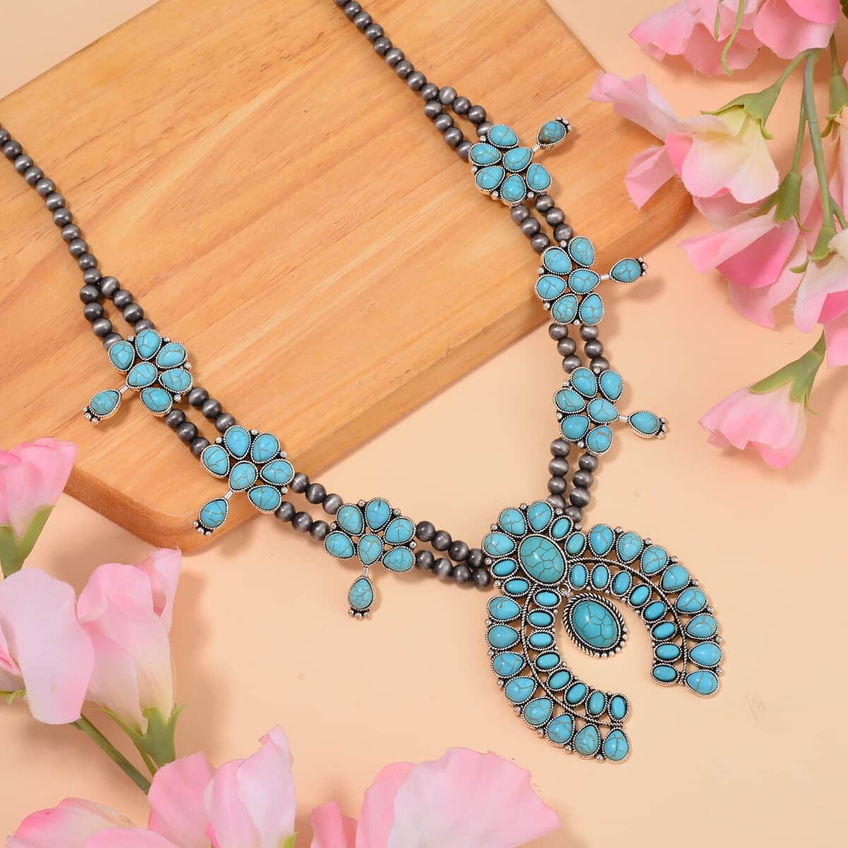 Constituted Blue Howlite Squash Blossom Necklace 24-28 Inches in Silvertone 20.00 ctw image number 1