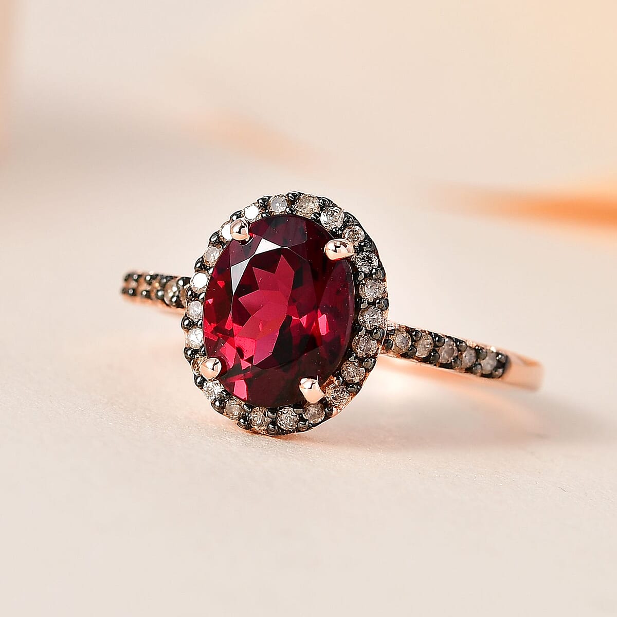 Premium Tanzanian Wine Garnet and I3 Natural Champagne Diamond 2.50 ctw Halo Ring in 10K Rose Gold (Size 8.0) image number 1