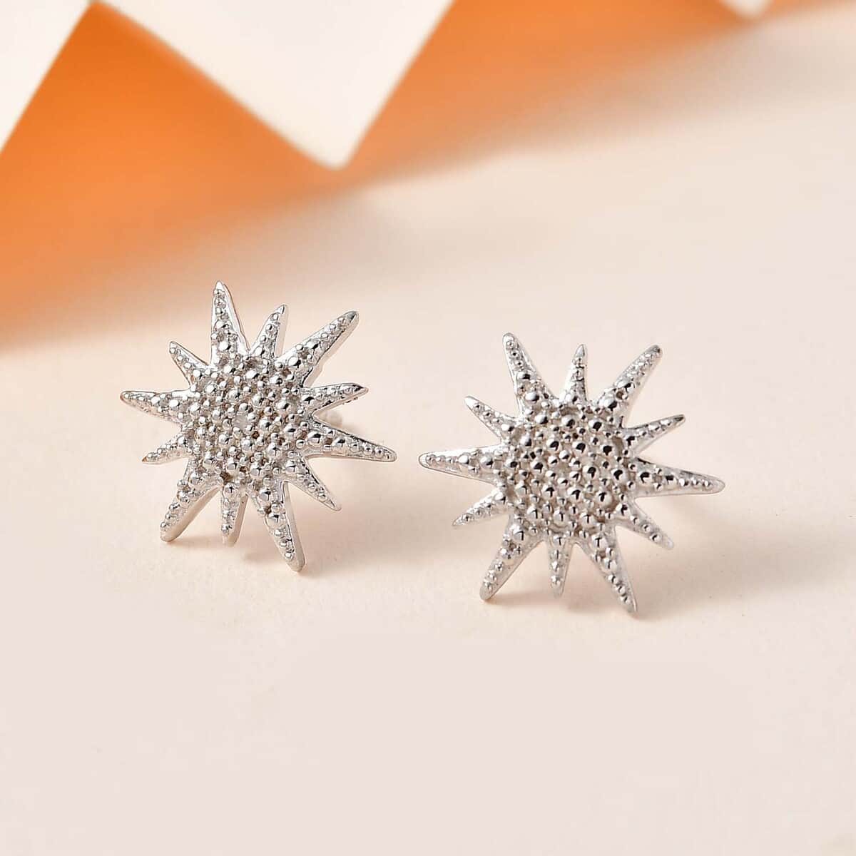 Diamond Accent Sunburst Stud Earrings in Platinum Over Sterling Silver image number 1