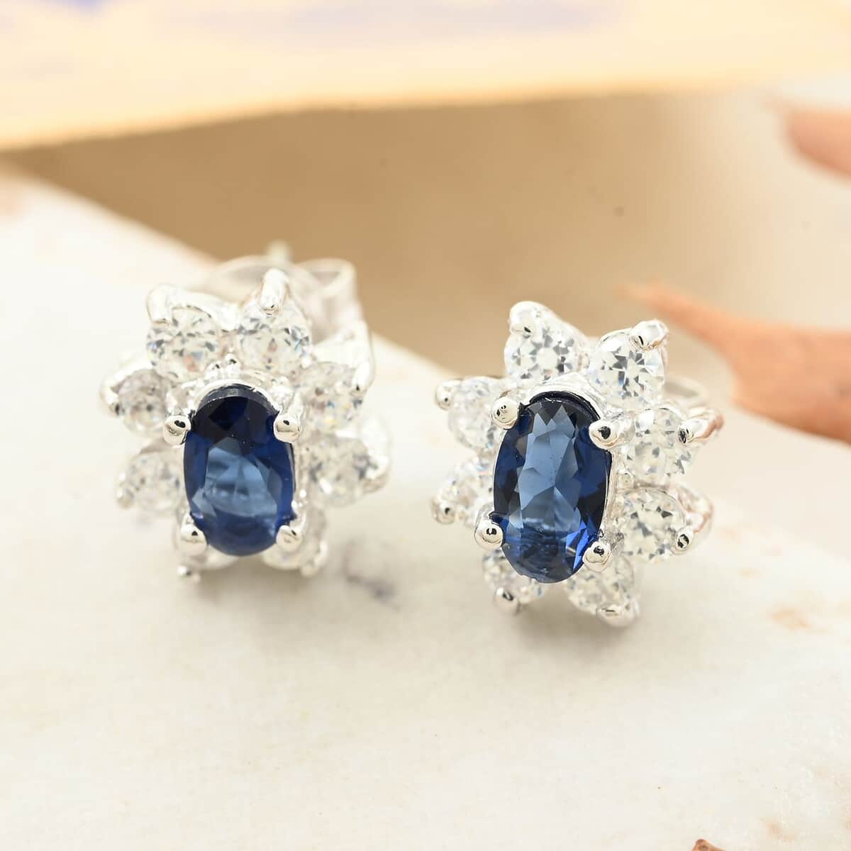 Simulated Blue and White Color Diamond Earrings in Silvertone image number 1