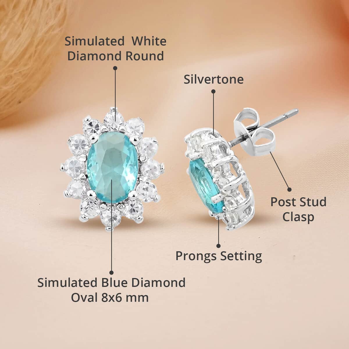 Simulated Blue and White Diamond Halo Stud Earrings in Silvertone image number 4