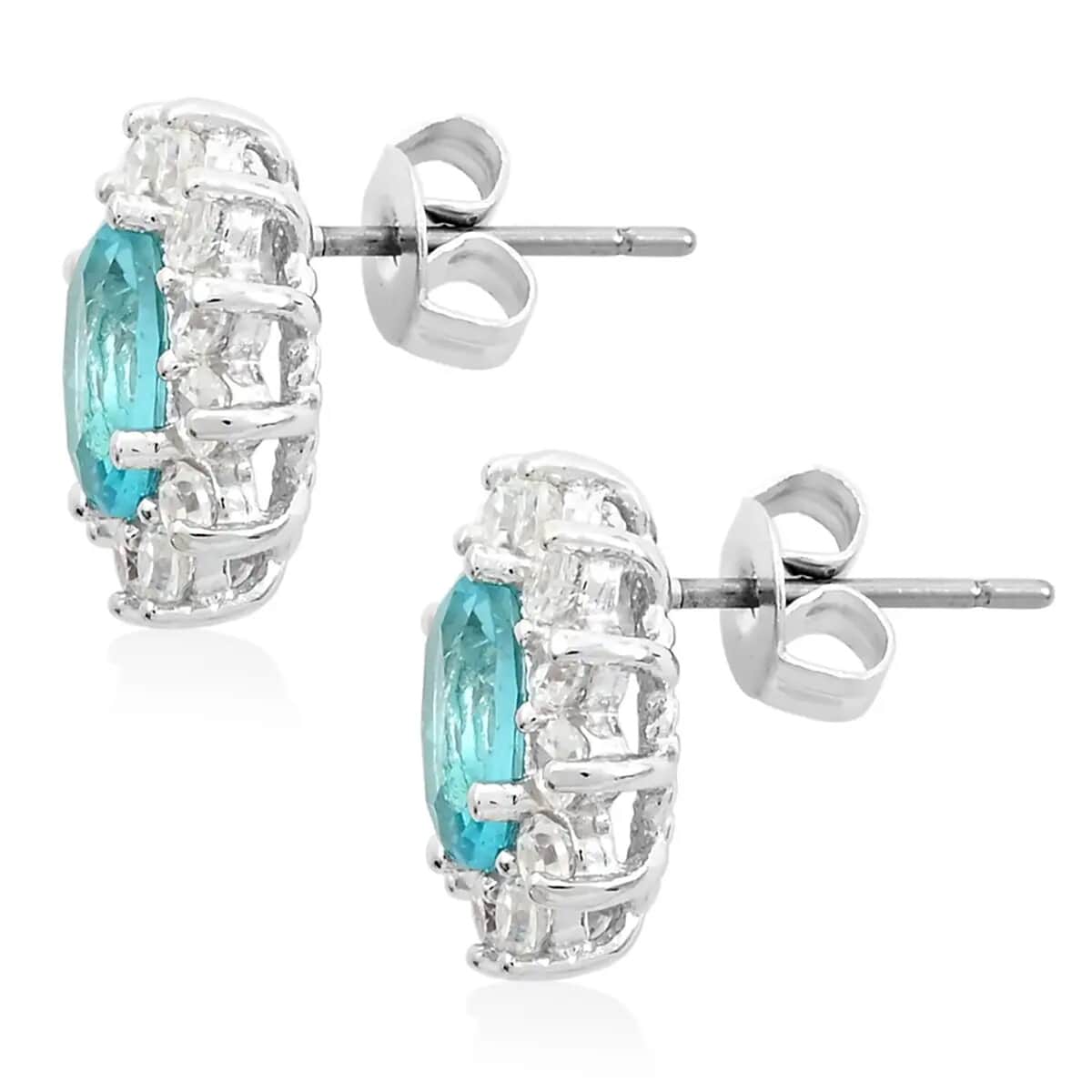 Simulated Blue and White Diamond Halo Stud Earrings in Silvertone image number 8