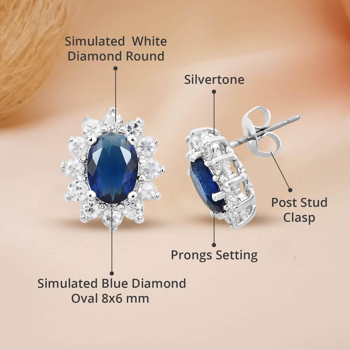 Simulated Blue and White Diamond Halo Stud Earrings in Silvertone image number 4