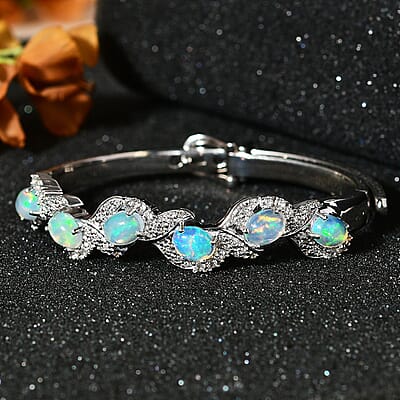 Ethiopian Welo Opal and White Zircon Bangle Bracelet in Platinum Over Sterling Silver (7.25 In) 6.00 ctw
