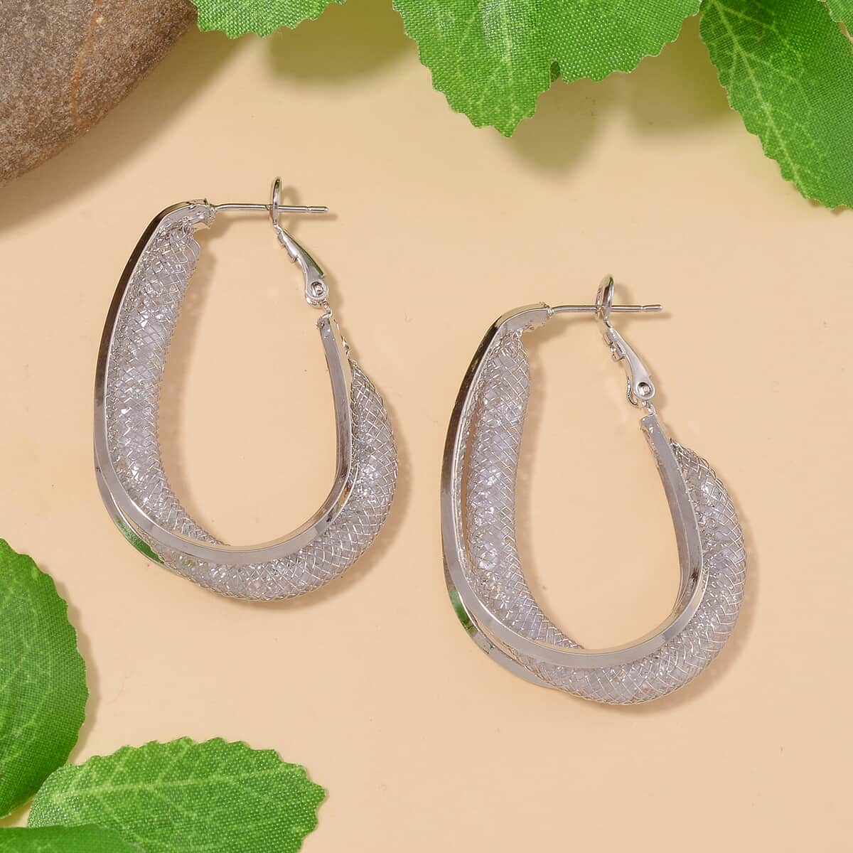 Sparkly White Austrian Crystal Inside Out Hoop Earrings in Silvertone image number 1