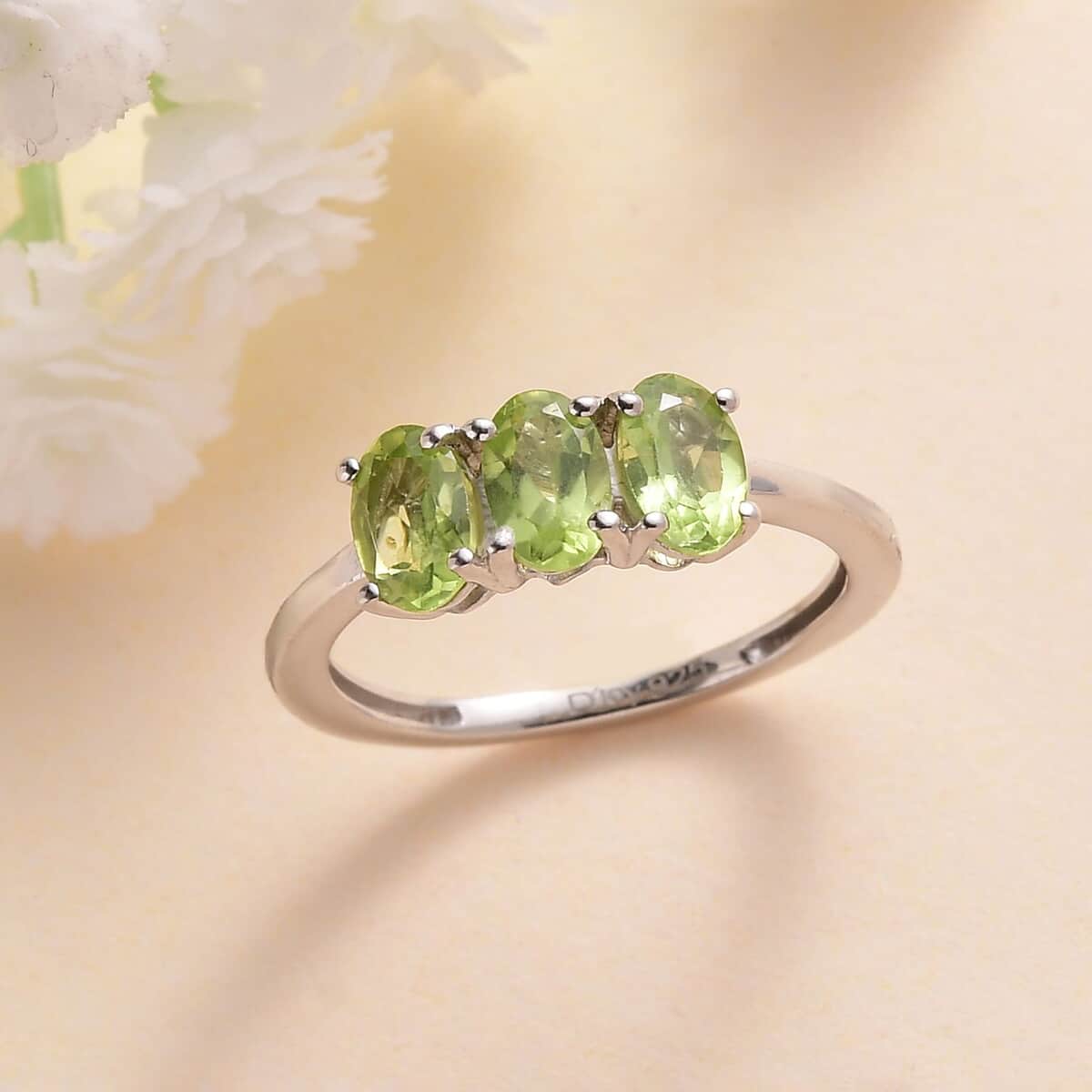 Peridot 3 Stone Ring in Platinum Over Sterling Silver (Size 6.0) 1.40 ctw image number 1