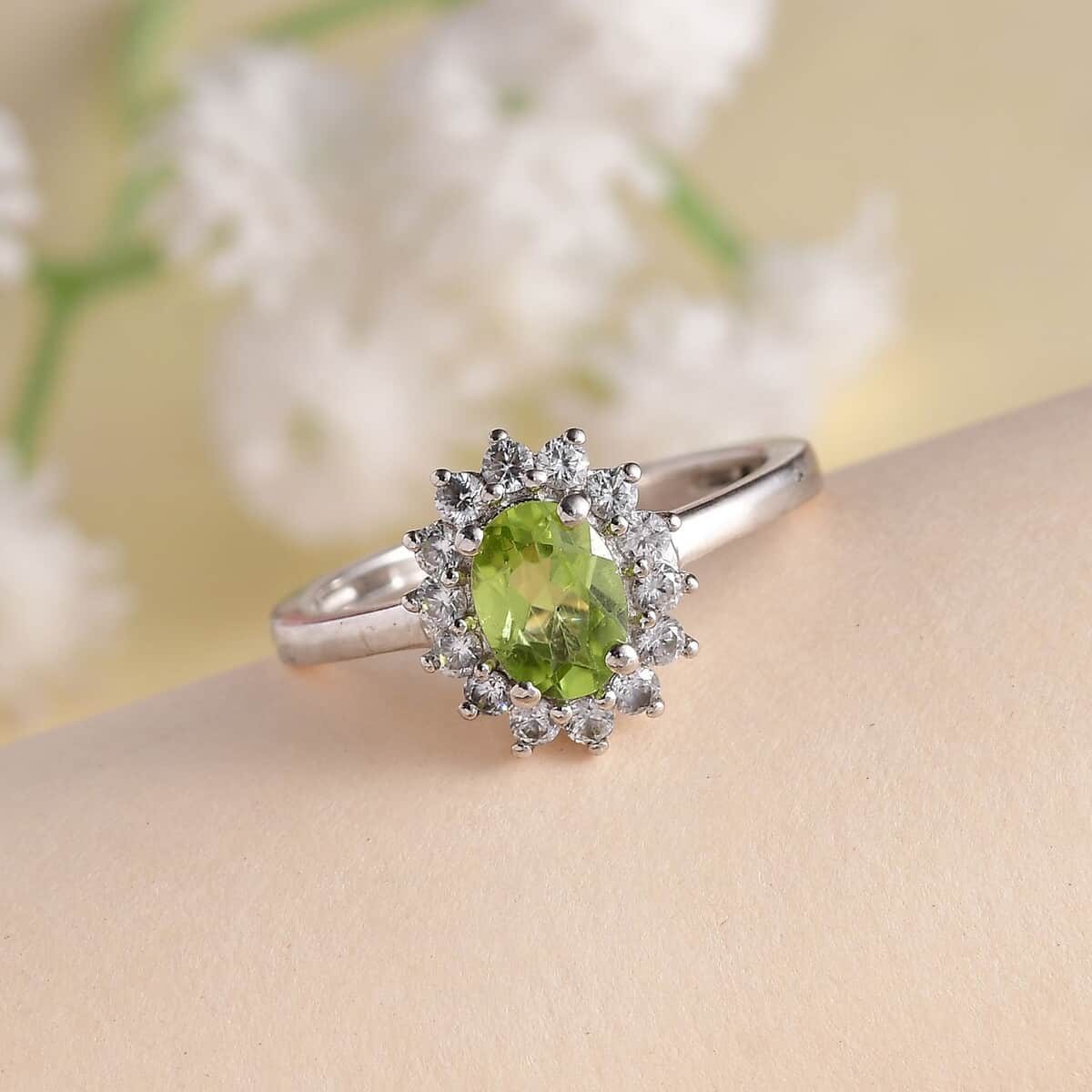 Peridot and White Zircon Sunburst Ring in Platinum Over Sterling Silver (Size 5.0) 1.25 ctw image number 1