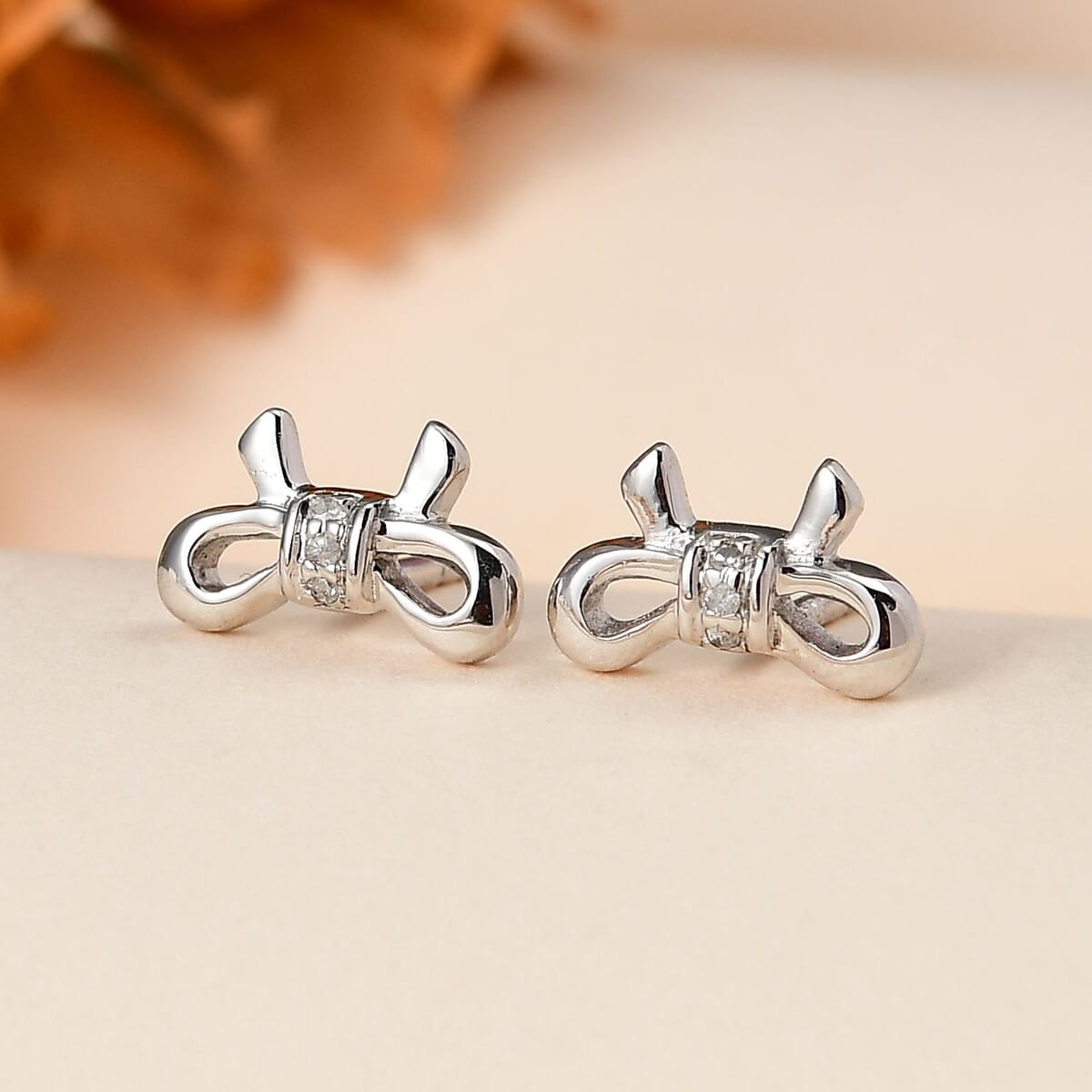 Diamond Accent Bow Knot Stud Earrings in Vermeil YG Over Sterling Silver image number 1