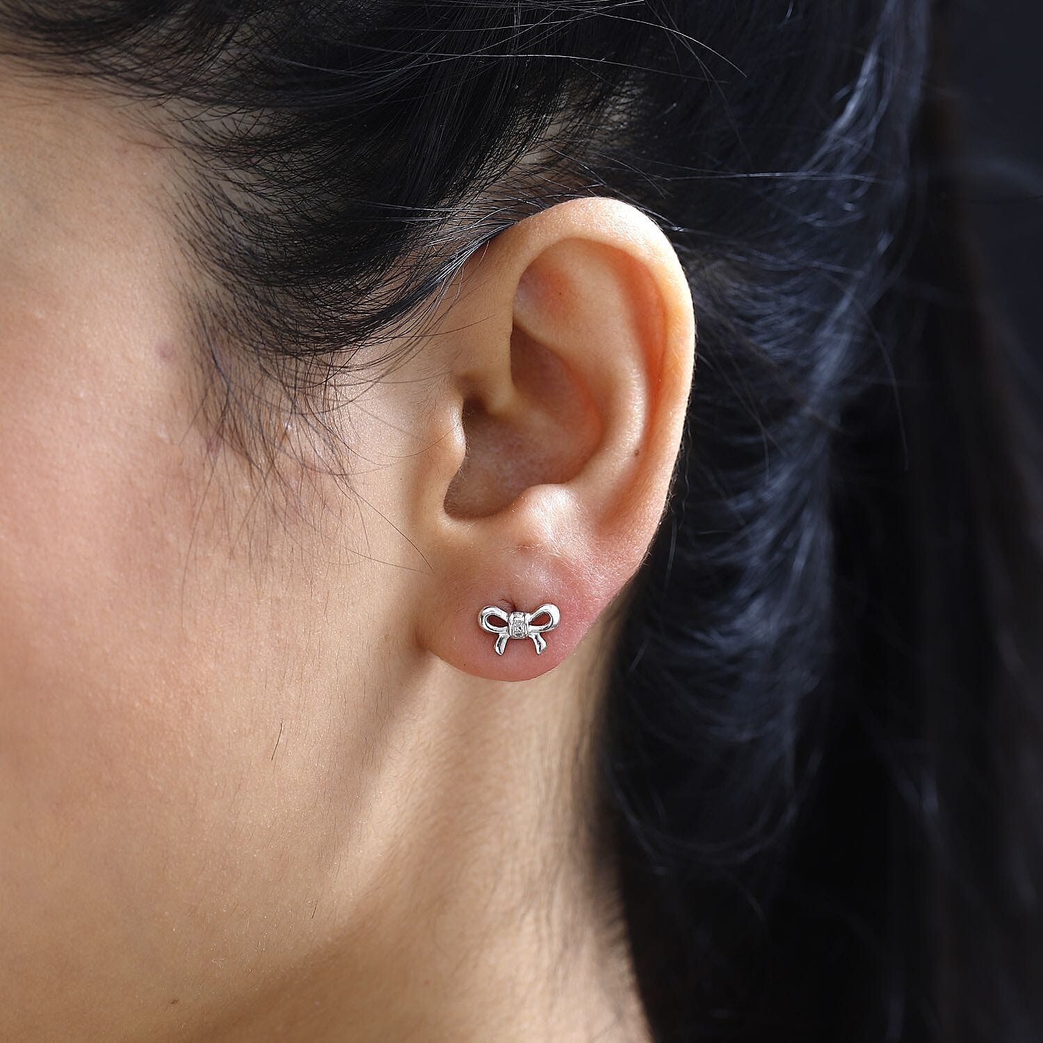Diamond Accent Bow Knot Stud Earrings in Platinum Over Sterling Silver