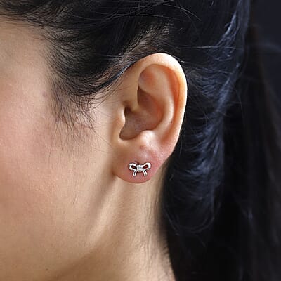 Diamond Accent Bow Knot Stud Earrings in Platinum Over Sterling Silver