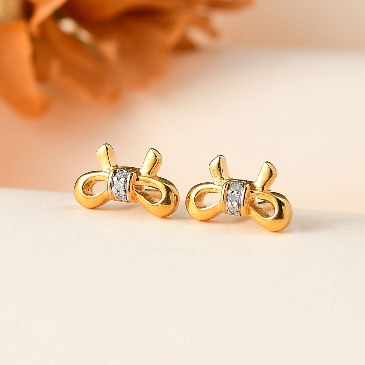 Diamond Accent Bow Knot Stud Earrings in Vermeil Yellow Gold Over Sterling Silver image number 1