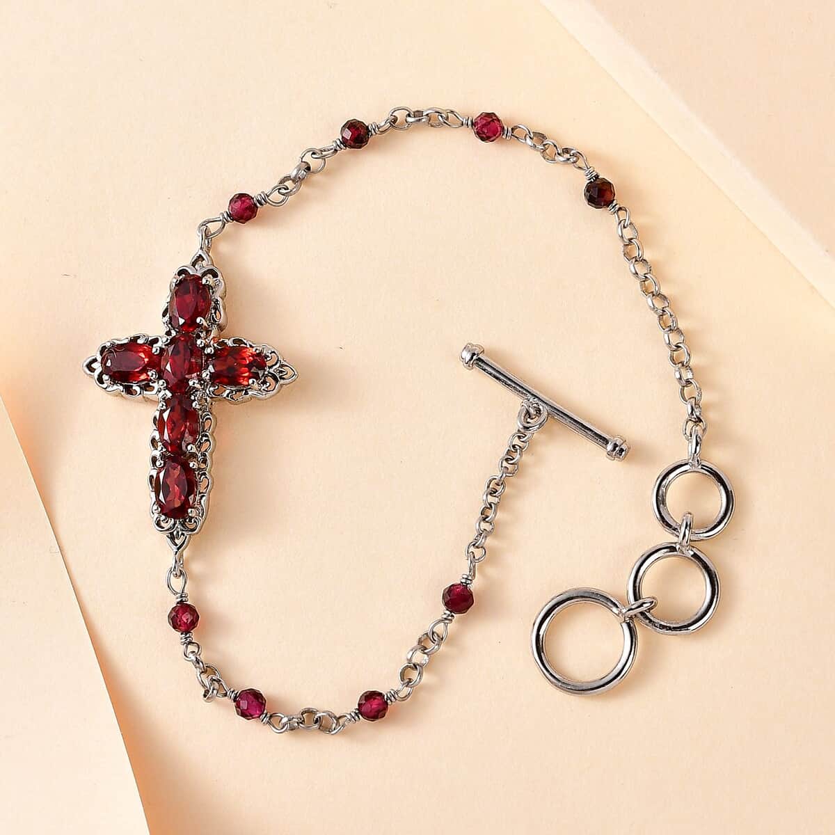 Karis Mozambique Garnet Cross Bracelet in Platinum Bond (6.50-8.00In) 5.00 ctw image number 1