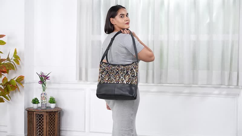 "100%  Genuine Leather embellished Hobo Shoulder Bag Size: 17(L) x 4.5 (W) x 12(H)  inches Color: Black "