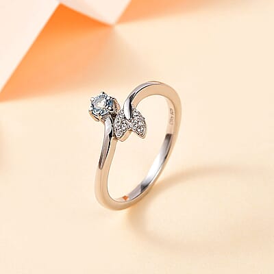 Santa Maria Aquamarine and White Zircon Fish Tail Bypass Ring in Platinum Over Sterling Silver (Size 10.0) 0.20 ctw