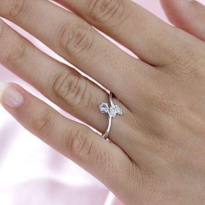 Santa Maria Aquamarine and White Zircon Fish Tail Bypass Ring in Platinum Over Sterling Silver (Size 10.0) 0.20 ctw