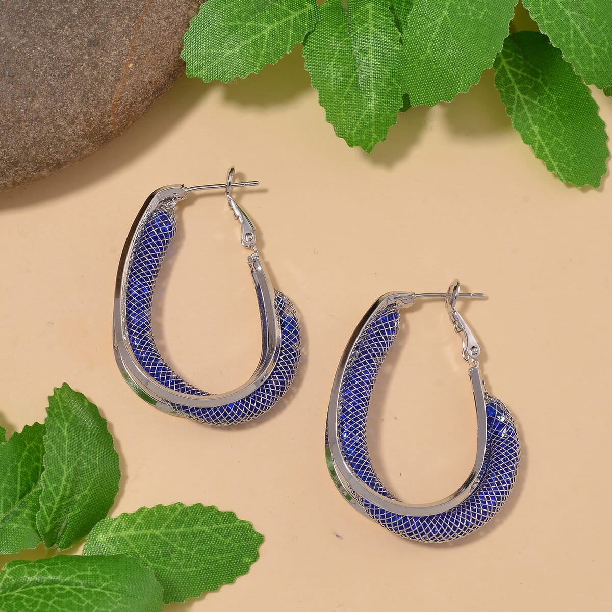 Sparkly Blue Austrian Crystal Inside Out Hoop Earrings in Silvertone image number 1