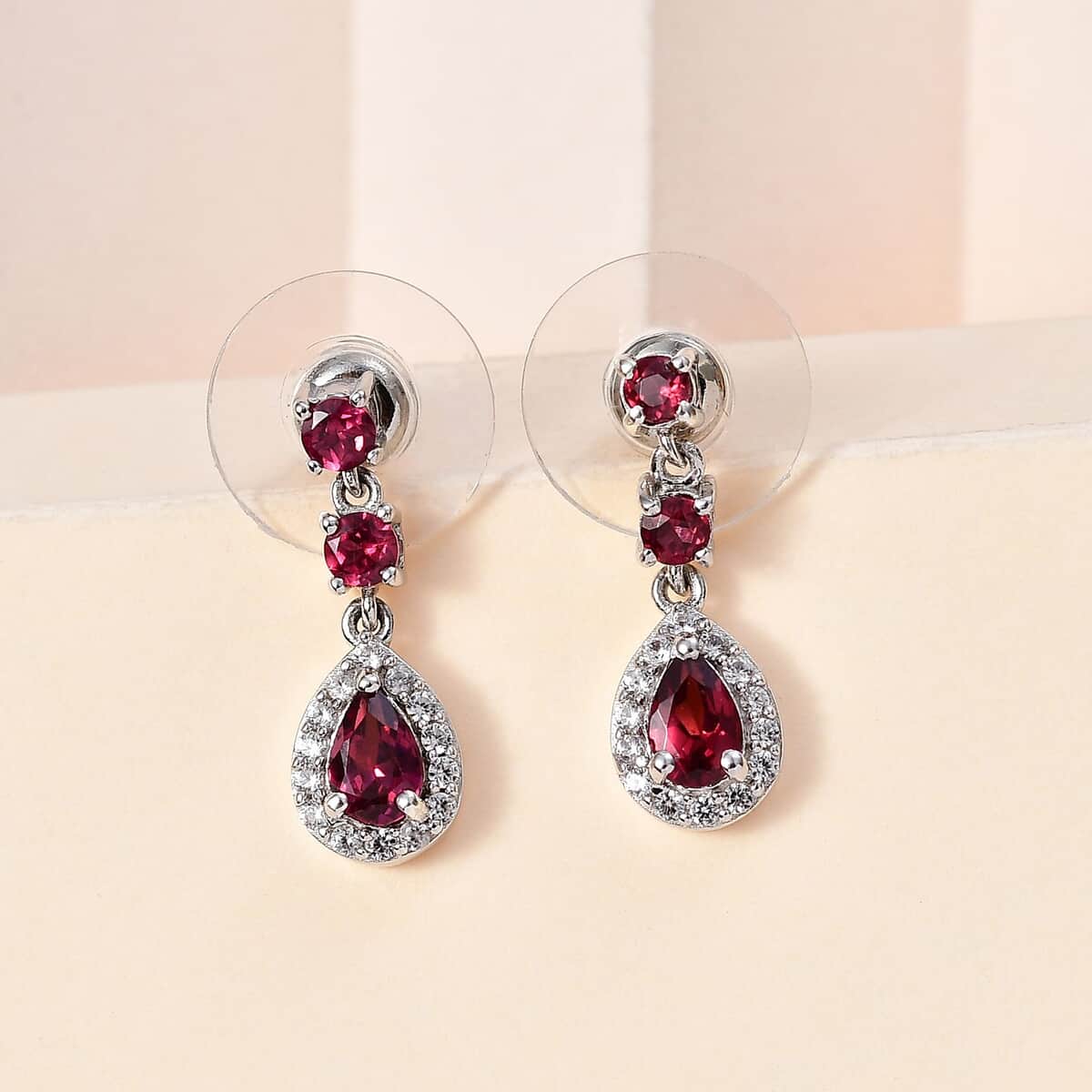 Tanzanian Wine Garnet and White Zircon Halo Dangle Earrings in Rhodium Over Sterling Silver 2.00 ctw image number 1