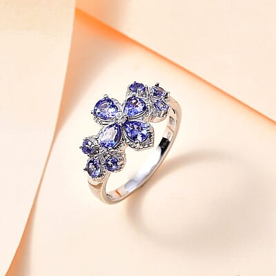AAA Tanzanite and White Zircon Plumeria Floral Ring in Rhodium Over Sterling Silver (Size 10.0) 1.80 ctw