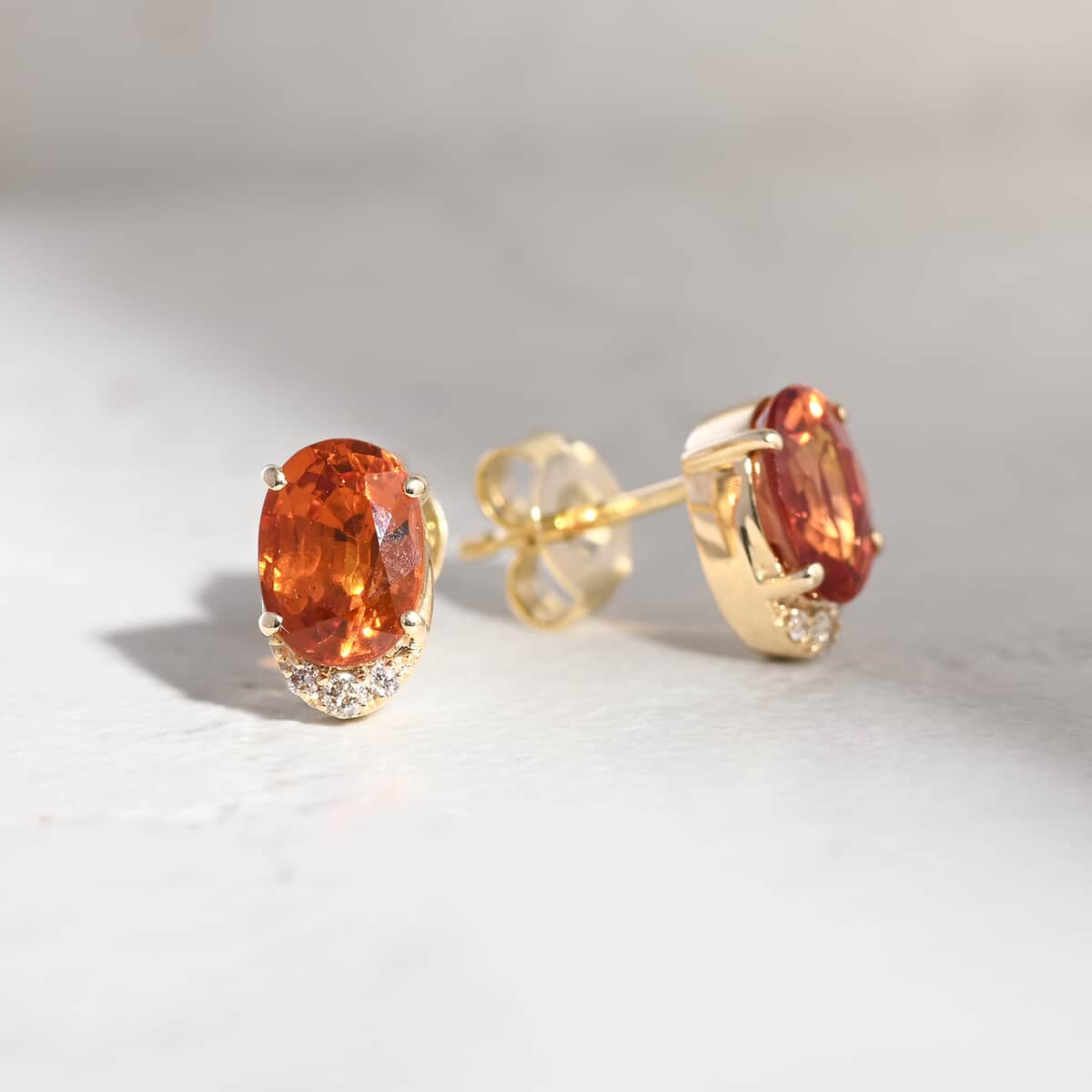 Luxoro AAA Red Sapphire and I2 Diamond 2.20 ctw Stud Earrings in 10K Yellow Gold image number 1