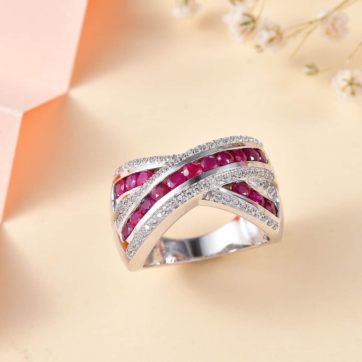 Premium Mozambique Ruby and White Zircon Criss Cross Ring in Rhodium Over Sterling Silver (Size 5.0) 2.20 ctw image number 1