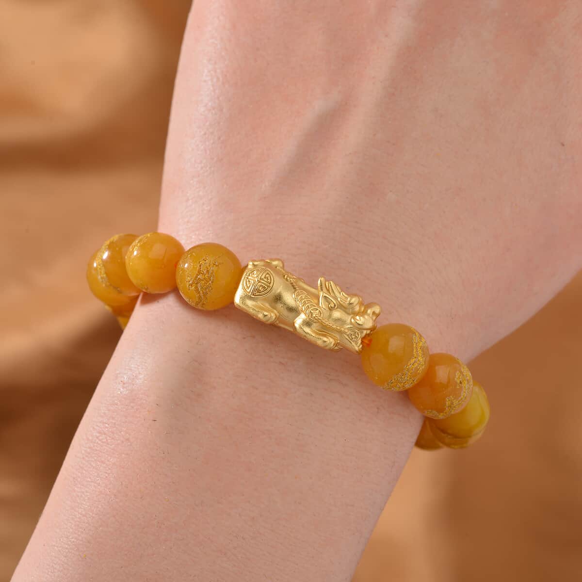 Honey Jade (D) Dragon Carved Beaded 150.00 ctw Stretch Pixiu Bracelet in 14K YG Over Sterling Silver  image number 1