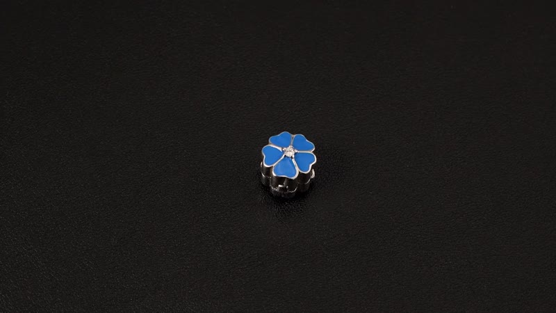 Simulated Diamond and Enameled Blue Flower Charm in Rhodium Over Sterling Silver