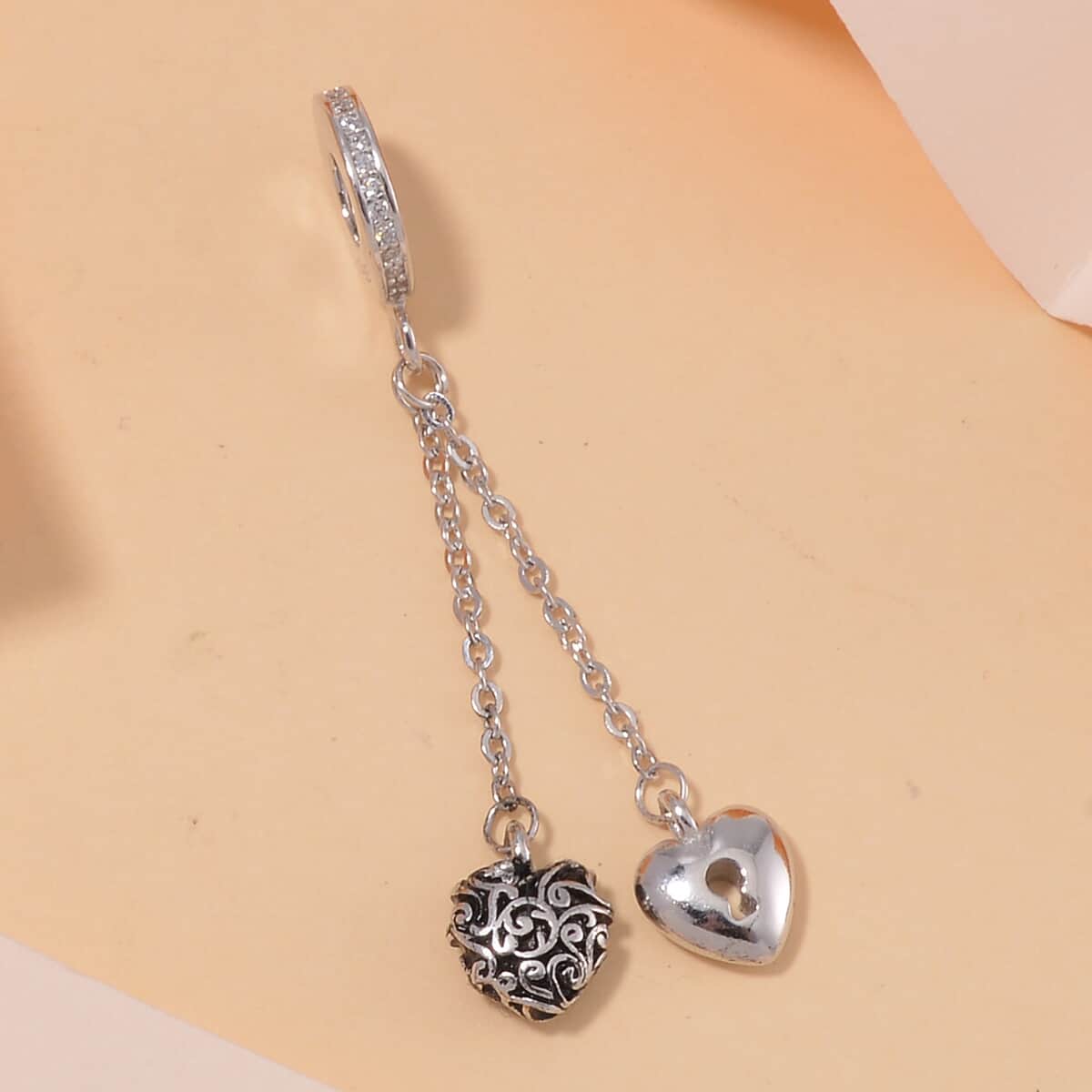 Simulated Diamond Heart to Heart Charm in Rhodium Over Sterling Silver image number 1