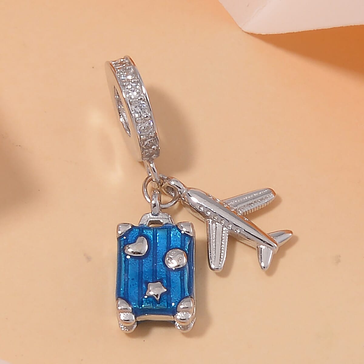 Simulated Diamond, Enameled A Trip that Goes without Saying Charm in Rhodium Over Sterling Silver