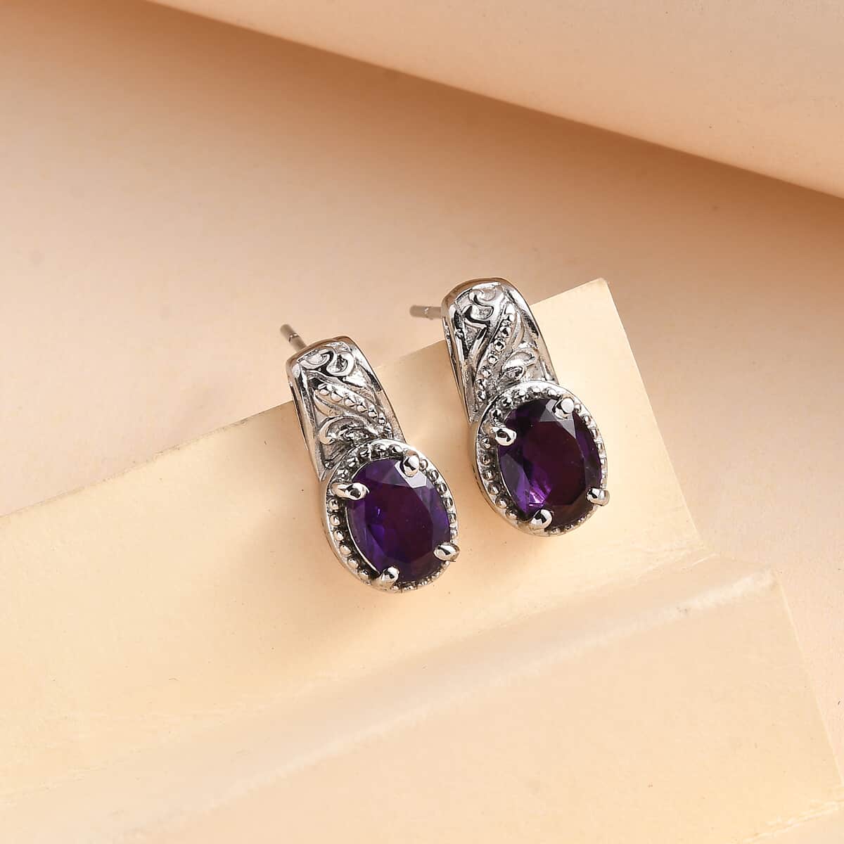 African Amethyst 2.25 ctw Solitaire Stud Earrings in Stainless Steel image number 1