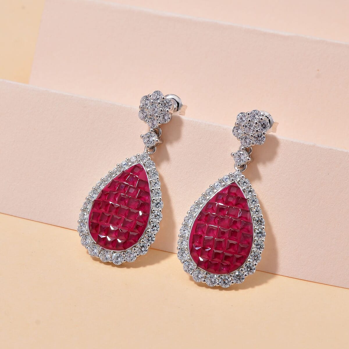 Simulated White and Ruby Color Diamond Drop Earrings in Rhodium Over Sterling Silver image number 1