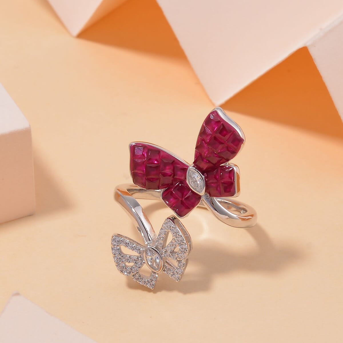 Simulated White and Ruby Color Diamond Butterfly Bypass Ring in Rhodium Over Sterling Silver (Size 9.0) image number 1