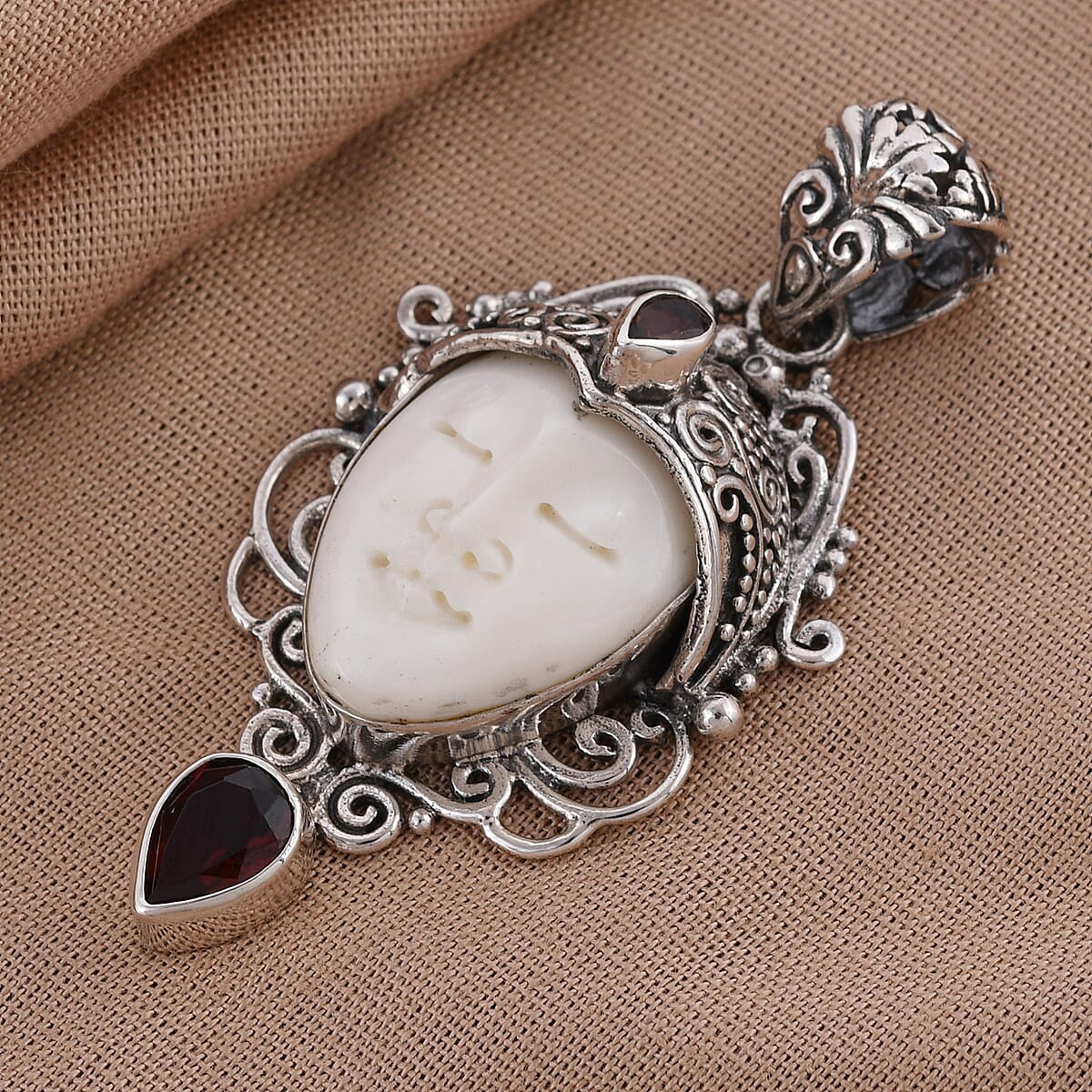Bali Goddess Carved Bone and Mozambique Garnet Pendant in Sterling Silver 10.30 Grams 1.10 ctw image number 1