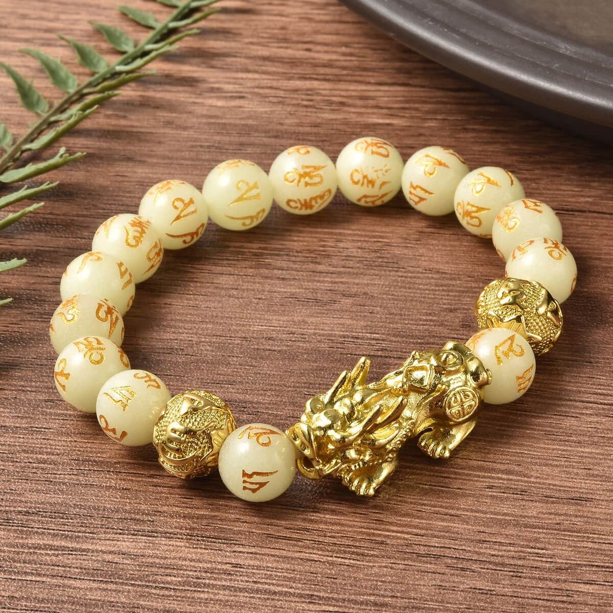 Feng Shui Pixiu Charm Luminous Carved Beads Stretch Bracelet in Goldtone, Stretchable Bracelet, Good Luck Birthday Gift 133.00 ctw image number 1