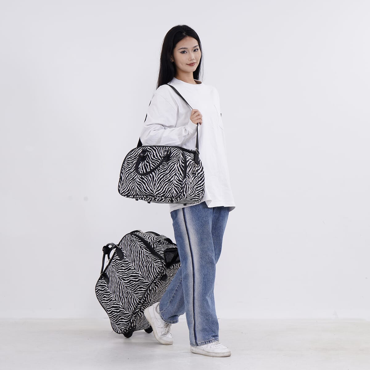 Set of 2 Black and White Zebra Stripe Pattern Wheeled Duffel Travel Bag image number 1