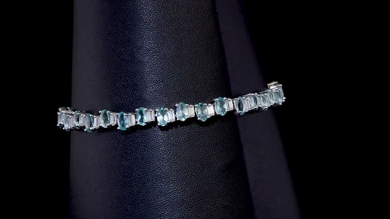 Madagascar Lagoon Apatite and Moissanite 10.70 ctw Ocean Wave Bracelet in Rhodium Over Sterling Silver (7.25 In)