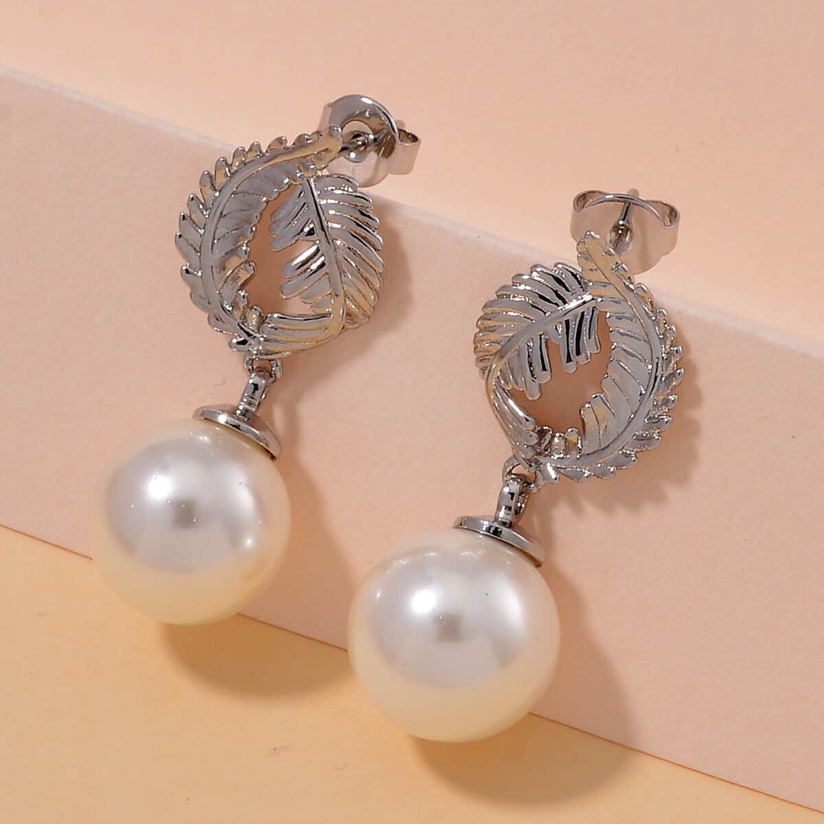 White Shell Pearl Drop Earrings in Silvertone image number 1