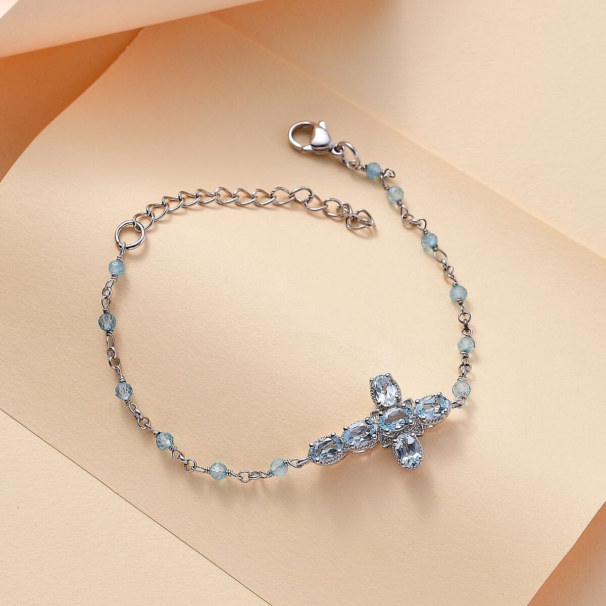 Karis Sky Blue Topaz 6.35 ctw Cross Bracelet in Platinum Bond (7.25-8.75In) image number 1